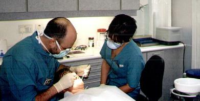 Graham and Chrissie carrying out a dental exam